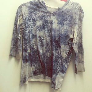 A  light and dark blue colored hoodie long sleeve